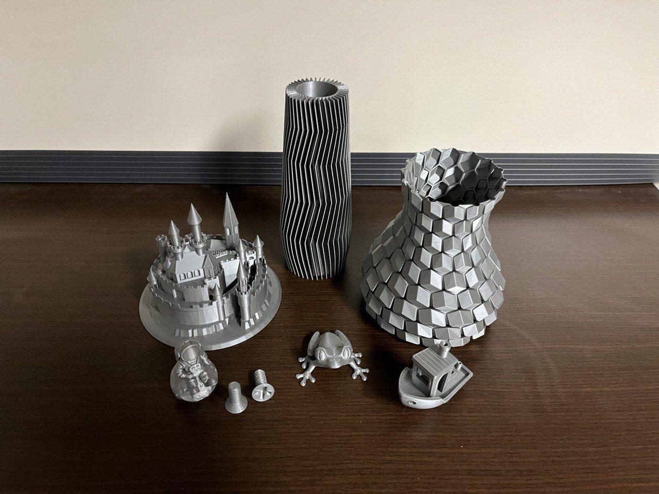 Group of grey 3D printed objects.